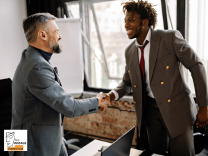 handshake between two people at interview